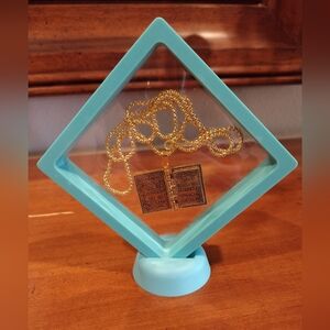 Holy Bible necklace, 24" chain, gold tone.